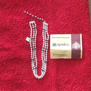 Authentic Majorica multi trend necklace with green stones.